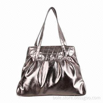 Fashion handbag, made of PU material, in bronze color and have quilting decoration
